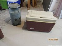 Full view showing Koolaroo cooler with two vintage dairy cans beside it