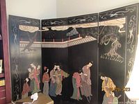 Full view of four joined panels showing hand-painted Japanese figures in traditional attire on black lacquer background with decorative borders.