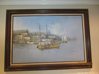 Framed painting hung on wall, full view