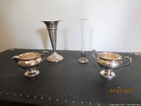 Four items total, two Fisher sterling silver sugar and creamer, AMC bud vase, sterling silver vase.