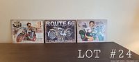 Front view of all three Route 66 retro style metal signs placed side by side showing their designs.