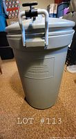 Front view of the gray Rubbermaid Animal Proof Garbage Bin showing the embossed brand and product name.
