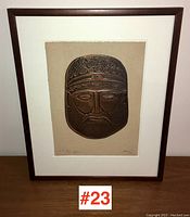 Full image of the framed copper relief artwork showing the entire face relief and frame, demonstrating overall condition and presentation.