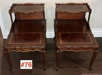 Pair of Baetz Bros. wooden step end-tables with two leather inset tops each, showing front view.