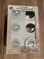 Photo of 4 white mini downlight housings for 3-inch recessed lighting in original box.