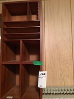 Front view of wooden Starbucks organizer, showing multiple compartments and storage slots, with sticker showing measurements 17x11x26 inches.