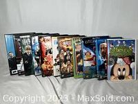 Photo of 11 DVDs in collection with various titles facing forward, showing DVD spine art and covers.