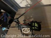 Side view of RC helicopter frame including rotor and wiring