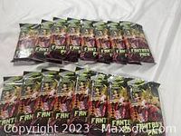 Photo showing 50 unopened Fantasy Pack expansion packs arranged in rows on a white surface.