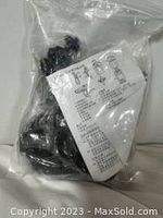 Plastic sealed bag containing dash cam parts and instruction sheet with setup diagrams