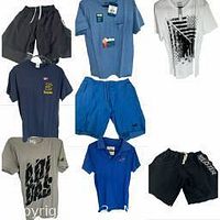 Photo showing 8 medium men's shirts and 3 shorts arranged on flat surface