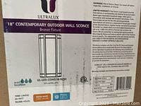 Label on Ultralux 18" Contemporary Outdoor Wall Sconce box showing brand, model, lighting specifications, and warranty info.