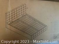 Line drawing diagram of upholstered platform bed showing general design and slatted support structure.