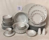 Photo showing full set of Franconia-Kreutheim Pirouette dishes including multiple sizes of plates, bowls, cups, and salt & pepper shakers arranged neatly.