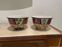 Two colorful large soup bowls with floral and abstract patterns on the outside