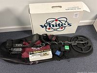 Overview of detector, coil, control box, pinpointer, bag, headphones, charger and box