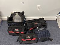 Overview of 5 tool bags of various sizes from Jobmate and Mastercraft in used but good condition