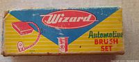 Front of box showing 'Wizard Automotive Brush Set' text and illustrations in vintage style with yellow, blue, and red colors.