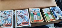 Box open showing several stacks of Eddie Murray baseball cards in different card designs, featuring Baltimore Orioles uniforms.