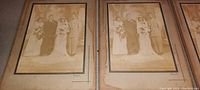 Four large antique sepia-tone wedding group photos mounted on cardboard covers, shown side by side. Photos measure approximately 14 by 10 inches.