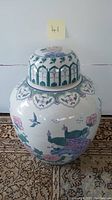 Full view of the large covered ginger jar showing overall shape and decorative designs.