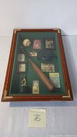 Full view of the vintage Sherwood Brands baseball shadow box displaying a collection of items including a bat, ball, cap, figurine, and various collectible cards.
