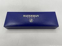 Closed royal blue Waterman Paris box with logo in gold lettering on lid.