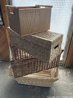 Image showing four stacked storage baskets with natural woven textures and different designs.