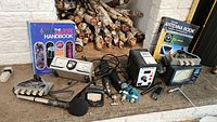 Group shot showing two reference books, coax switch, SWR power meter and CB microphone