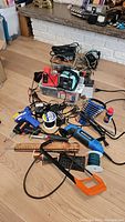 Overview of all tools and accessories spread on floor and countertop