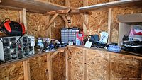 Overview of wooden shelves with various hardware items, cubby organizers, and tools assorted on them.