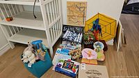 General view of entire toy and game lot including chess set, puzzles, backpack and dartboard