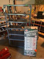 Full view of assembled metal shelving unit and boxed shelving unit with label displayed.