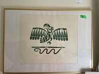Full view of the framed print showing bird and serpent artwork with gold frame and white mat.