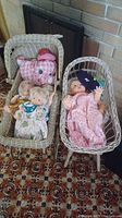 First photo showing two vintage dolls in a wicker doll crib and one doll with a plush toy pig.