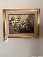 Full view of the framed original oil painting with floral design and gold-tone frame with linen liner.