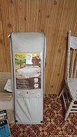 Full view of inflatable bed in gray carrying bag with Byo Bed label visible on the packaging.