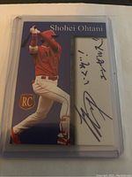 Front of Shohei Ohtani rookie card showing player in red Angels uniform with facsimile autograph section and RC logo