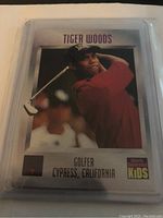 Front side of Tiger Woods trading card showing photo and basic info.