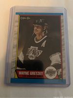 Front of Wayne Gretzky hockey card showing player in Los Angeles Kings jersey with OPC branding and card number 156.