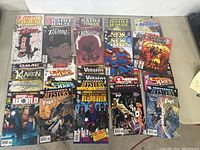 Photo of multiple DC Comics comic books laid out, including Justice League, Zatanna, Suicide Squad, and more.