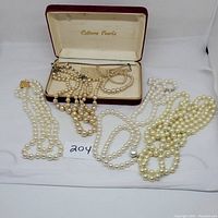 Full lot of vintage pearl and faux pearl necklaces displayed with Cultura Pearls box
