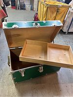 Photo showing the open foot locker with removable wooden tray pulled out, displaying two compartments inside the tray.