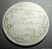 Reverse side of 1908 Canadian 25 cents silver coin showing value, country, year, and maple leaf wreath design.
