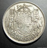 Obverse side of the silver 1939 Canada 50 cents coin with Canadian coat of arms, denomination, and date visible.