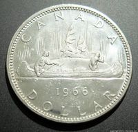 Reverse side showing canoe with two men and forest background, with inscription CANADA DOLLAR and year 1966
