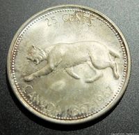 Obverse side of the 1967 Canadian 25 cents silver coin showing a wildcat (lynx) and denomination text with date 1867-1967.