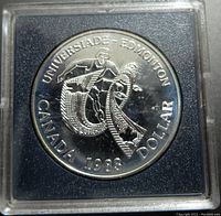 Front side of the coin showing athlete with torch and inscriptions Universiade Edmonton Canada 1983 Dollar.