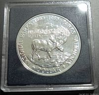 Obverse of coin showing moose and mountain with National Parks 1885-1985 marking