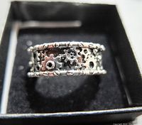 Front view of the silver mechanical gears ring showing intricate gear details and bolt-like border.
